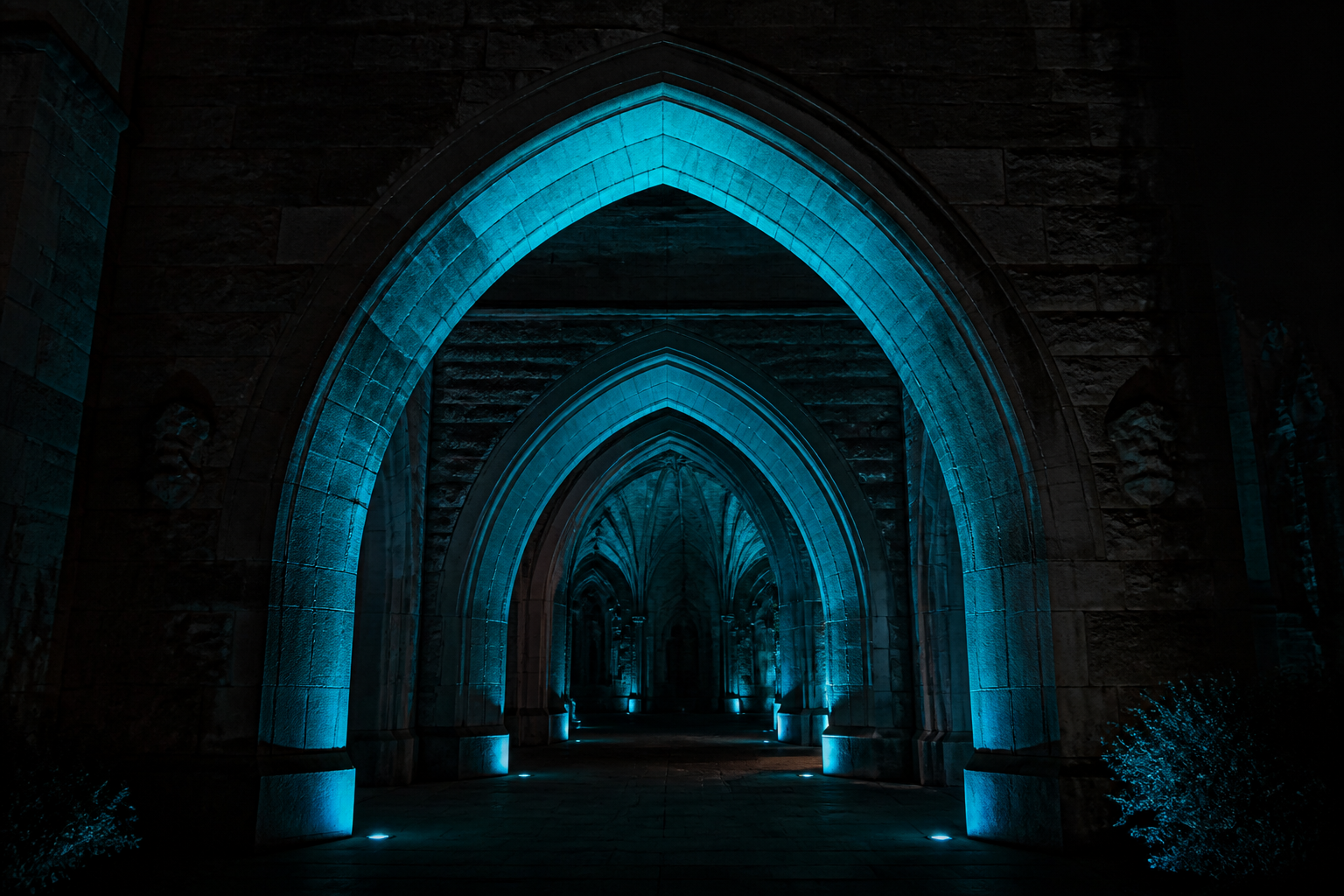Three nested gothic arches at night, teal light flowing backward toward ancestor vaults.